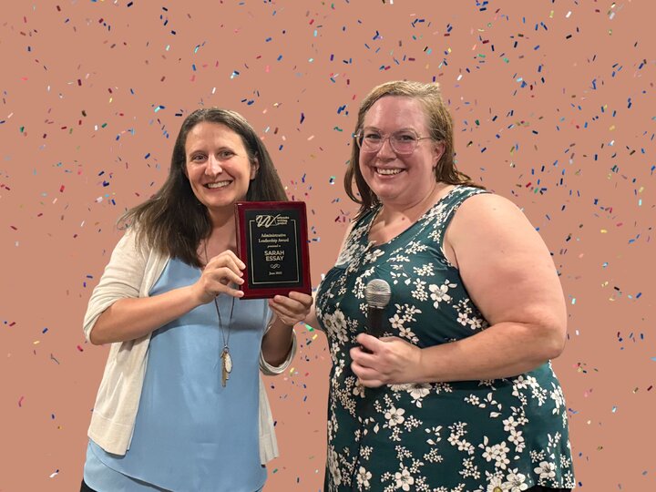 Racheal presenting award to Sarah Essay