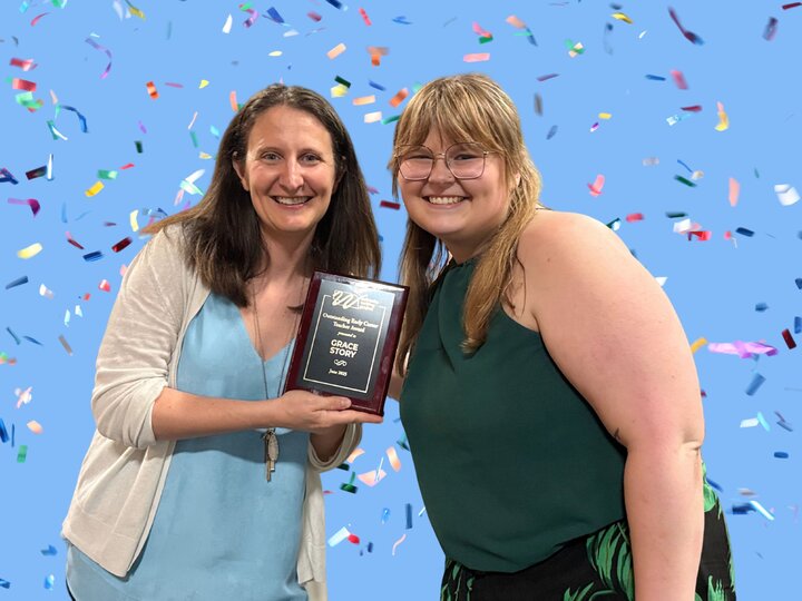 Nebraska Writing Project Directory, Racheal, presenting the award to winner, Grace Story